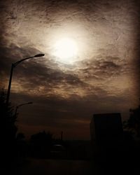 Low angle view of built structure against sunset