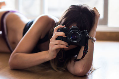 Portrait of woman photographing