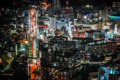 Aerial view of illuminated city buildings at night