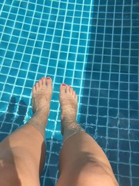 Low section of woman in swimming pool