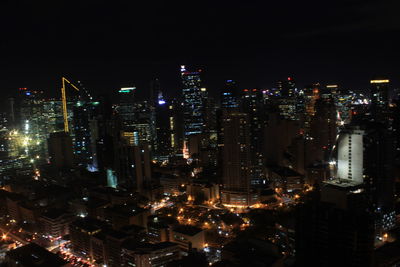 High angle view of illuminated buildings in city at night