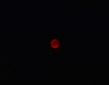 Low angle view of moon against sky at night