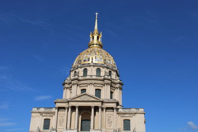 Low angle view of building against blue sky