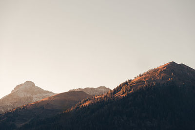 Minimalist landscape austrian alps sunset view from a passenger seat on a road trip