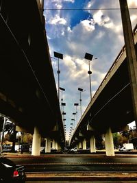 Low angle view of bridge against sky in city