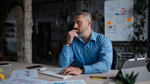 Young man working at desk in office