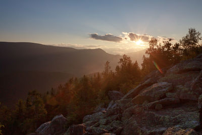 Scenic view of mountains against sky during sunset