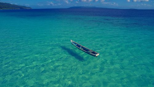 High angle view of boat in sea against sky