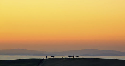 Silhouette mountain against sky during sunset