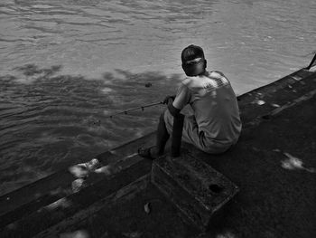 High angle view of man sitting on beach