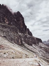 Scenic view of mountain against cloudy sky