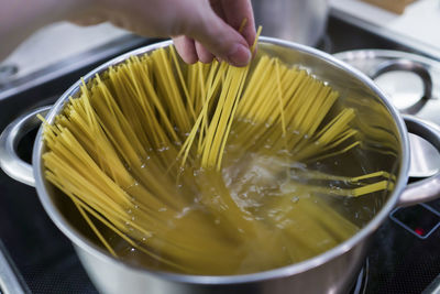 Close-up of person preparing food in bowl