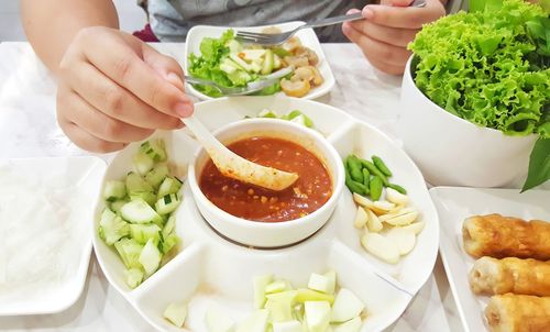 Midsection of man preparing food