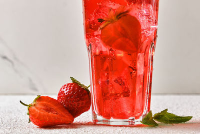 Close-up of strawberry in glass on table