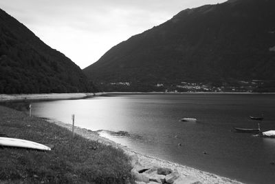 Scenic view of sea and mountains against sky