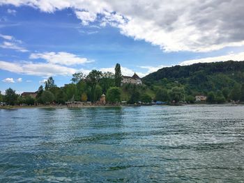 Scenic view of lake against cloudy sky