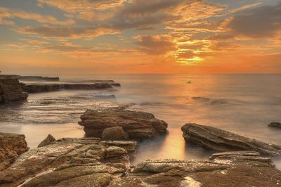 Scenic view of sea against sky during sunset