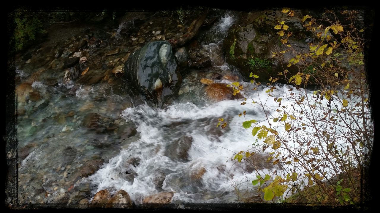 transfer print, water, auto post production filter, rock - object, nature, beauty in nature, tranquility, rock, high angle view, scenics, rock formation, flowing water, growth, stream, tranquil scene, plant, waterfall, river, day, moss