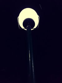 Low angle view of illuminated street light against clear sky