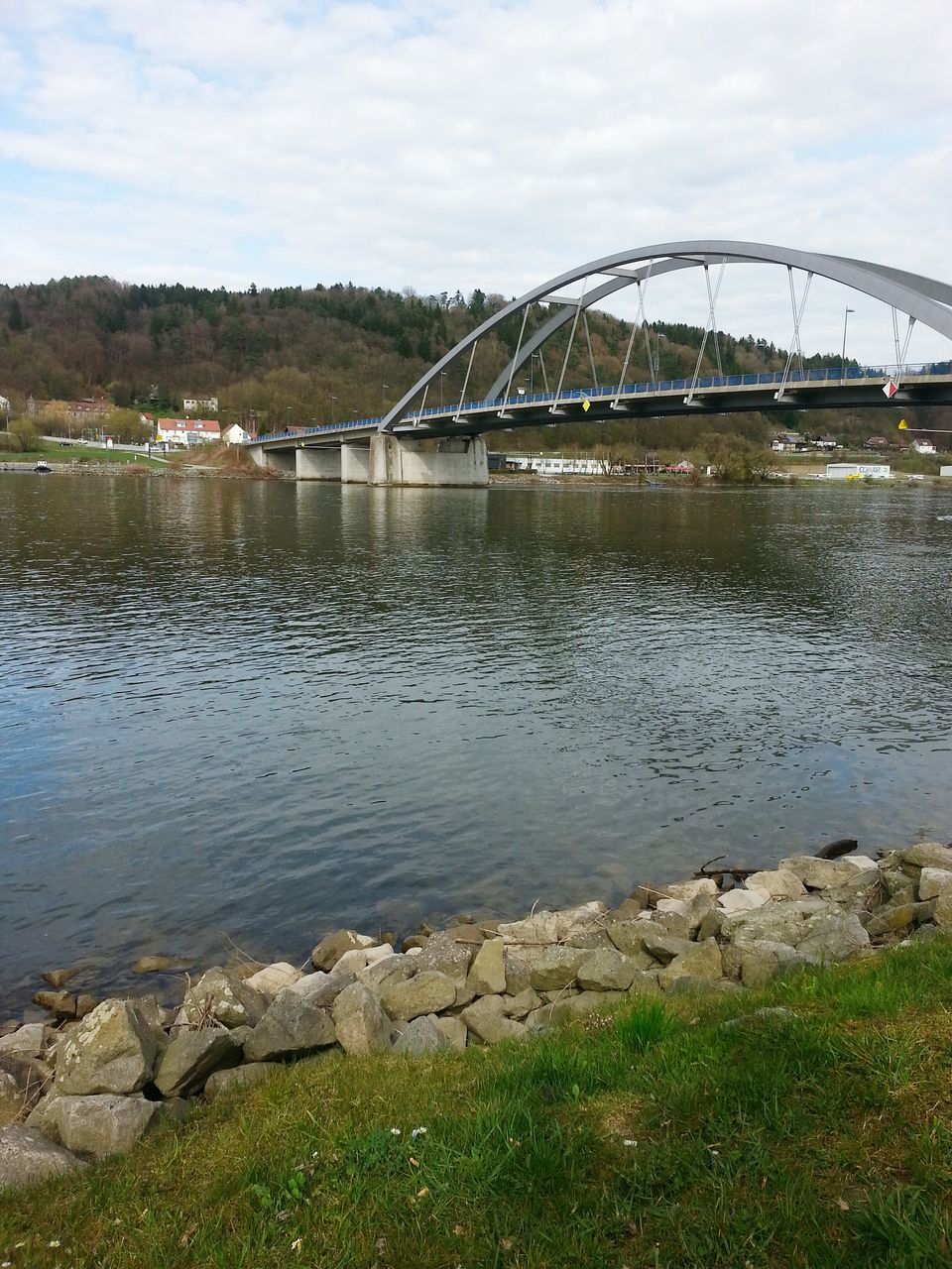 water, sky, built structure, architecture, river, bridge - man made structure, connection, cloud - sky, lake, cloud, reflection, transportation, building exterior, riverbank, nature, tranquility, tranquil scene, arch bridge, bridge, no people