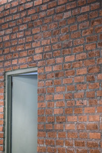 Low angle view of brick wall