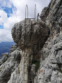 Low angle view of rock formation against sky