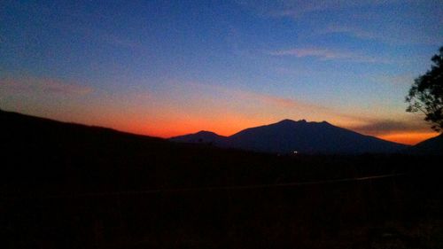 Scenic view of mountains at sunset