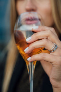 Close-up of woman drinking glass