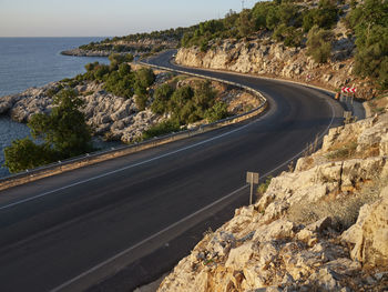 Road by sea against sky