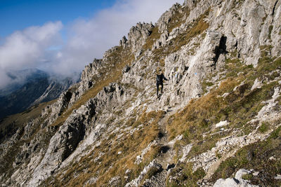 Full length of woman walking on mountain ridge