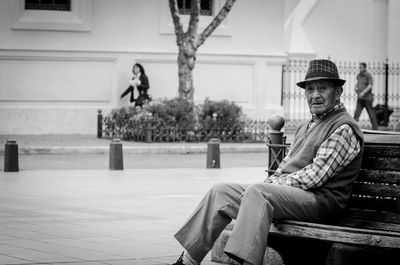 Portrait of man sitting on bench