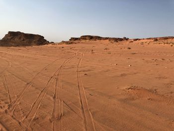 Scenic view of desert against clear sky