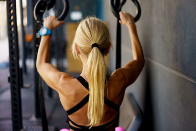 Low section of man exercising in gym