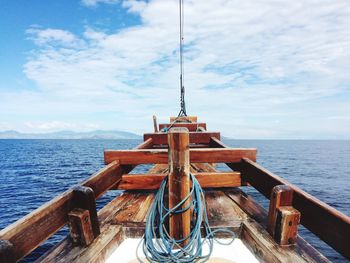 Ship sailing on sea against sky