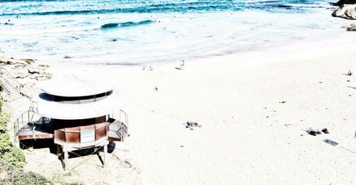 High angle view of chairs on beach