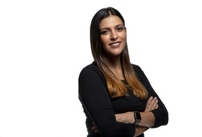 Portrait of a smiling young woman over white background