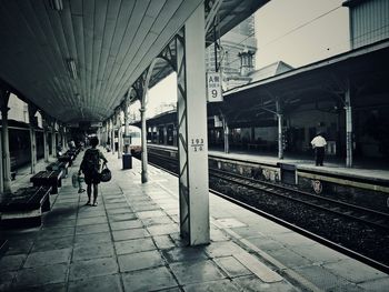 Woman at railroad station