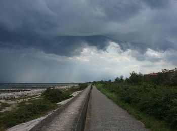 Road amidst landscape against sky