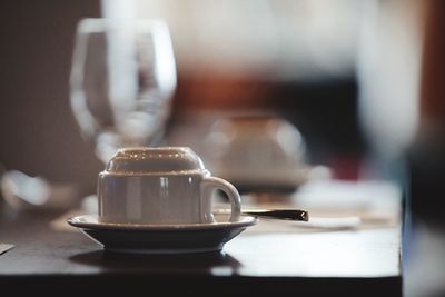 Close-up of coffee cup on table