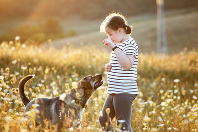 Full length of boy standing on field