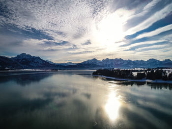 Scenic view of lake against sky during winter