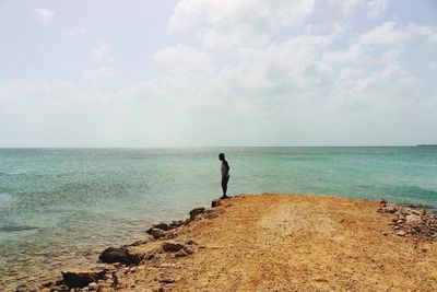 Scenic view of sea against cloudy sky