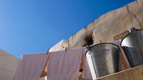 Low angle view of building against clear blue sky