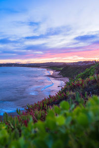 Scenic view of sea against sky at sunset