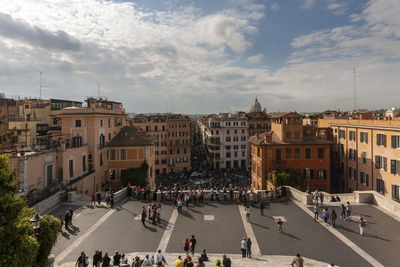 High angle view of people on road against buildings in city