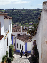 High angle view of houses and buildings in city