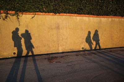 Shadow of people on wall