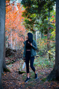 Full length of woman in woods