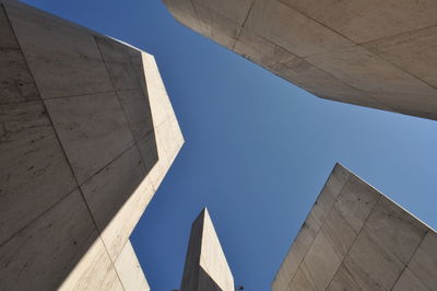 Low angle view of building against blue sky