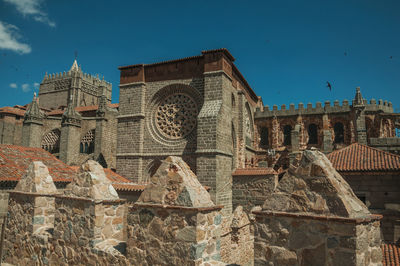 Low angle view of buildings against blue sky